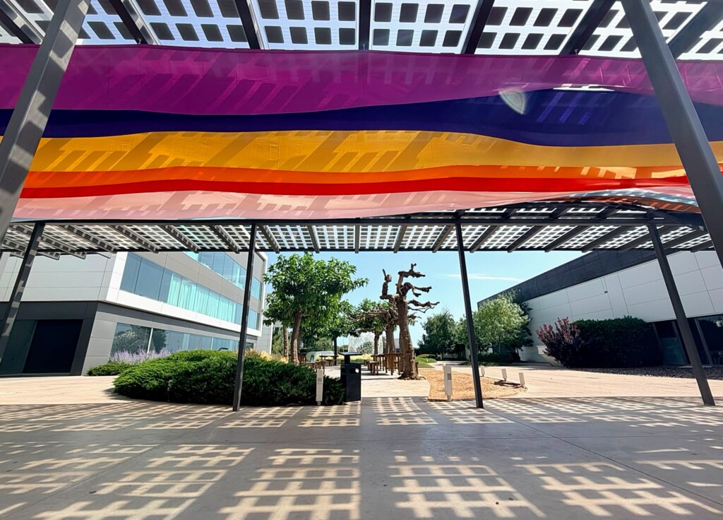Pride colour bands along the pergola, seen from the courtyard at Mango’s headquarters