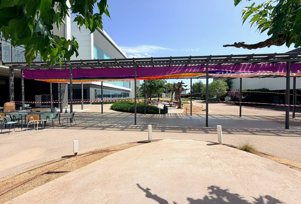 Overall view of the pergola with the Pride fabrics at Mango’s headquarters