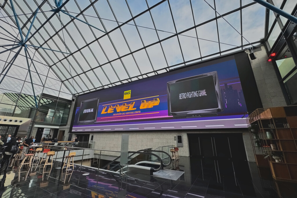 The glass-walled lobby with the big Level Up screen that welcomed attendees to RACC’s 2026 sales meeting