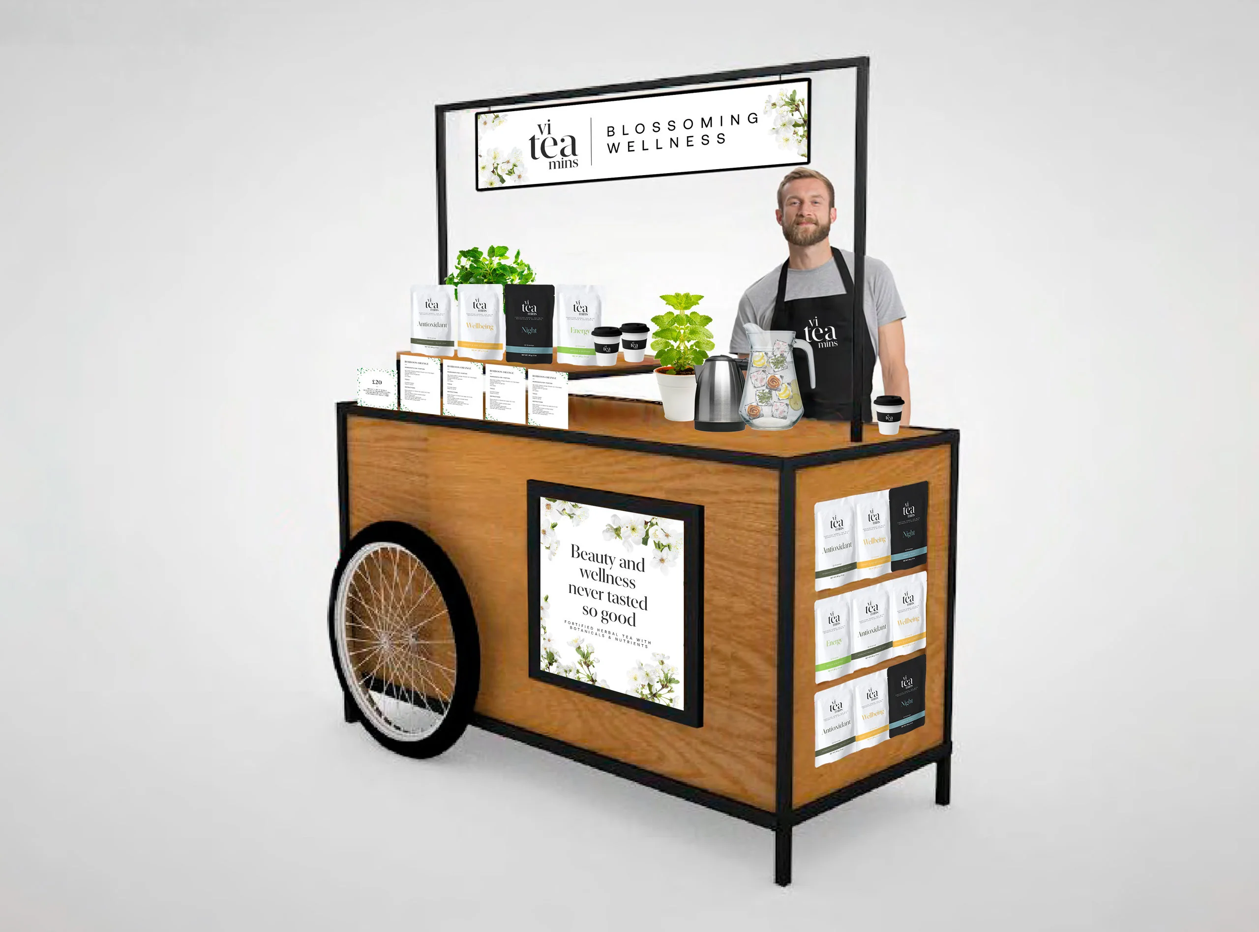 Recreación: carrito promocional Blossoming Wellness de viteamins con doypacks, carteles y delantal de la marca