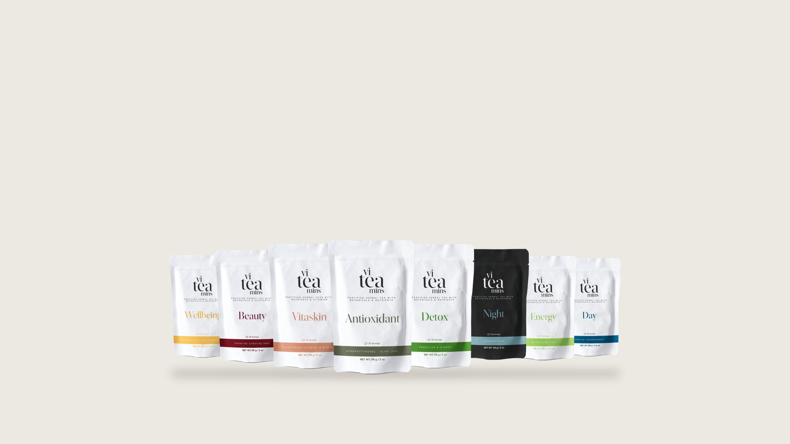 La gama viteamins en inglés: ocho doypacks, siete blancos y uno negro, cada uno con la banda de color de su infusión