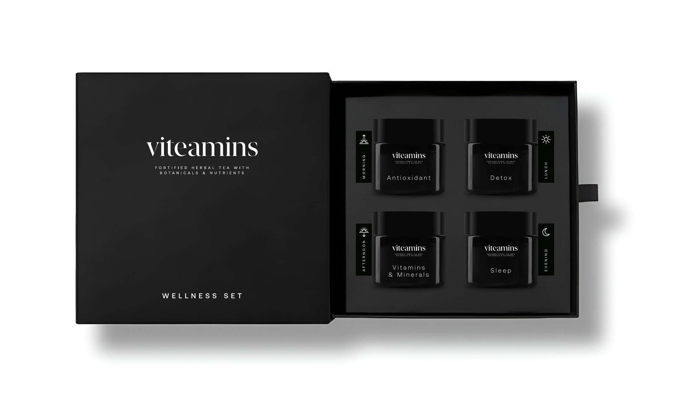 Wellness set de viteamins: caja negra abierta con cuatro tarros