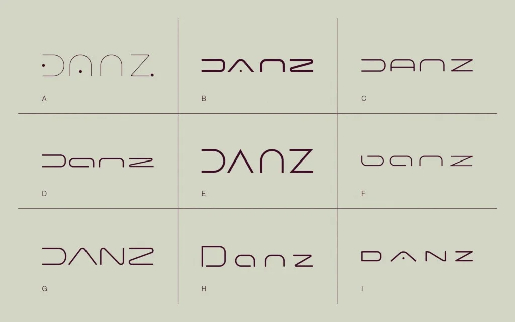 Las nueve propuestas de logotipo para DANZ Barcelona, de la A a la I, en burdeos sobre piedra