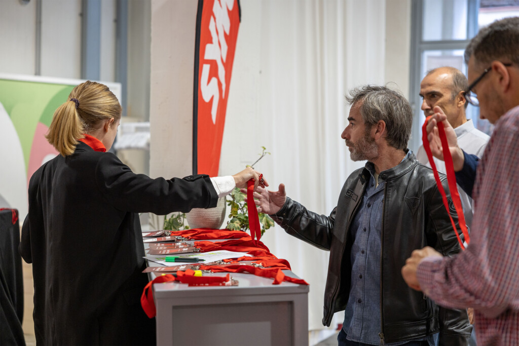 Guests being welcomed and collecting their passes at SYM España’s 20th anniversary